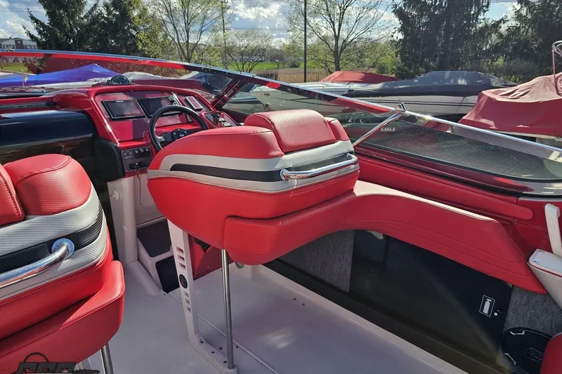 Slide: The Image of Interior of a 1997 Formula 382 FASTech boat with red and white seating. - 56