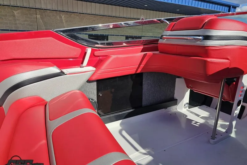 Slide: The Image of Red and gray interior of a 1997 Formula 382 FASTech boat, showcasing sleek seating design. - 57