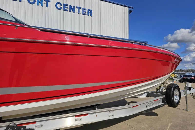 Slide: The Image of Red 1997 Formula 382 FASTech boat on trailer at a sport center. - 6
