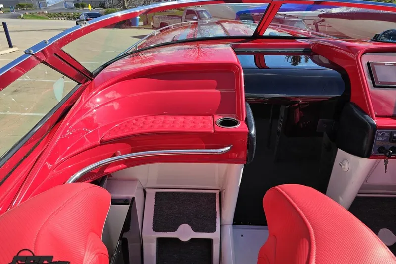 Slide: The Image of Interior of a 1997 Formula 382 FASTech boat with vibrant red seating and dashboard. - 60