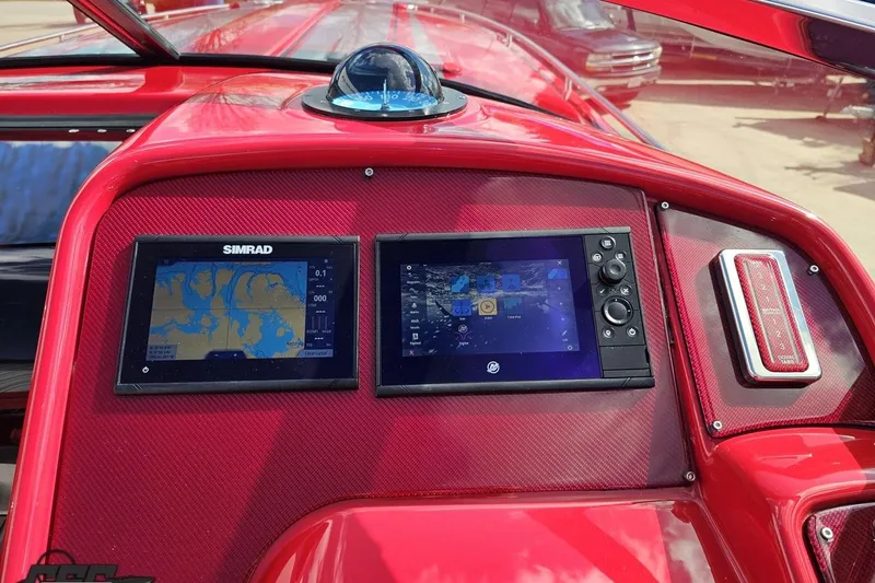 Slide: The Image of Red 1997 Formula 382 FASTech dashboard with dual Simrad navigation displays. - 65