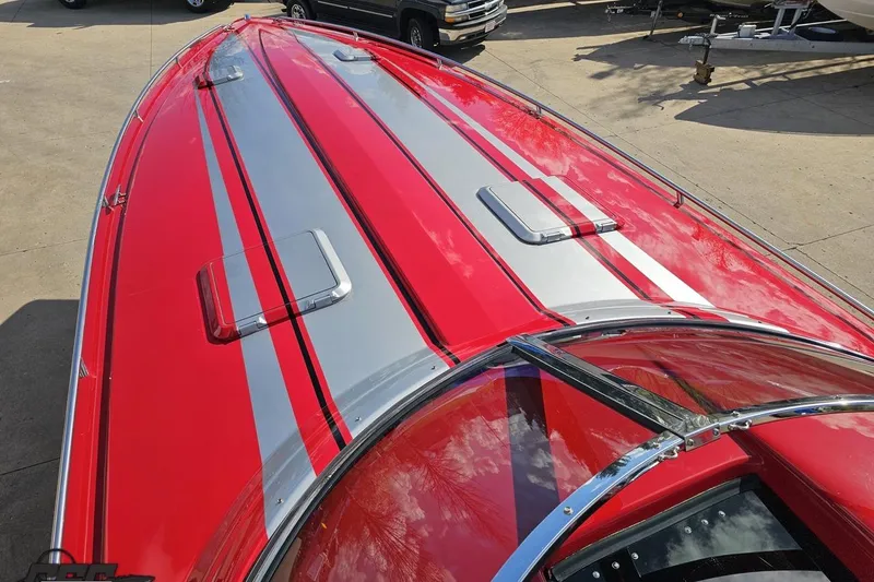 Slide: The Image of Red and silver 1997 Formula 382 FASTech boat, sleek design, parked on concrete. - 67