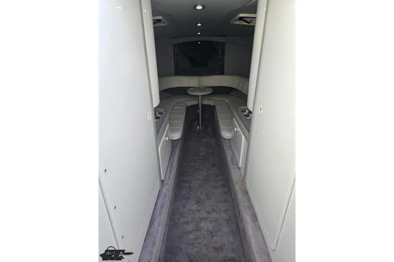 Slide: The Image of Interior of a 1997 Formula 382 FASTech boat, featuring plush seating and modern design. - 69