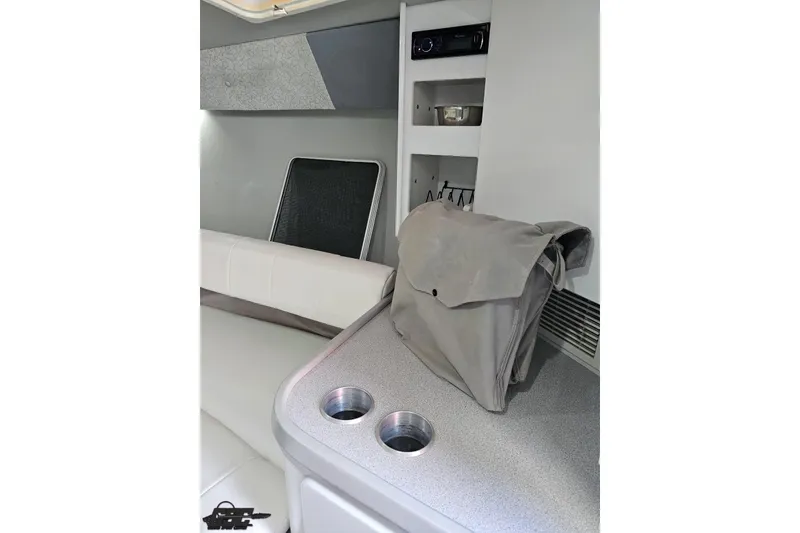 Slide: The Image of Interior of a 1997 Formula 382 FASTech boat with seating and storage compartments. - 73