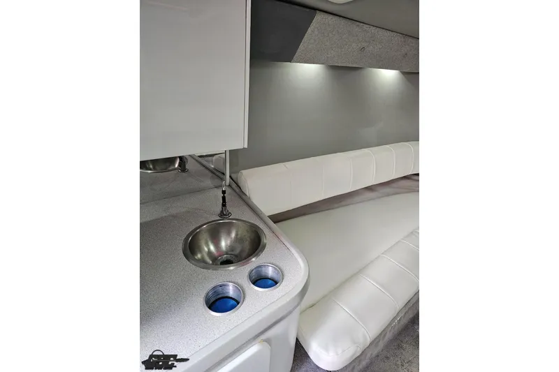 Slide: The Image of Interior of 1997 Formula 382 FASTech boat with sink and white seating. - 74