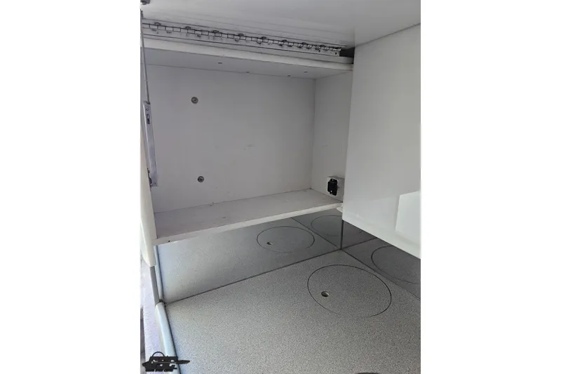 Slide: The Image of Interior view of a 1997 Formula 382 FASTech boat storage compartment. - 78