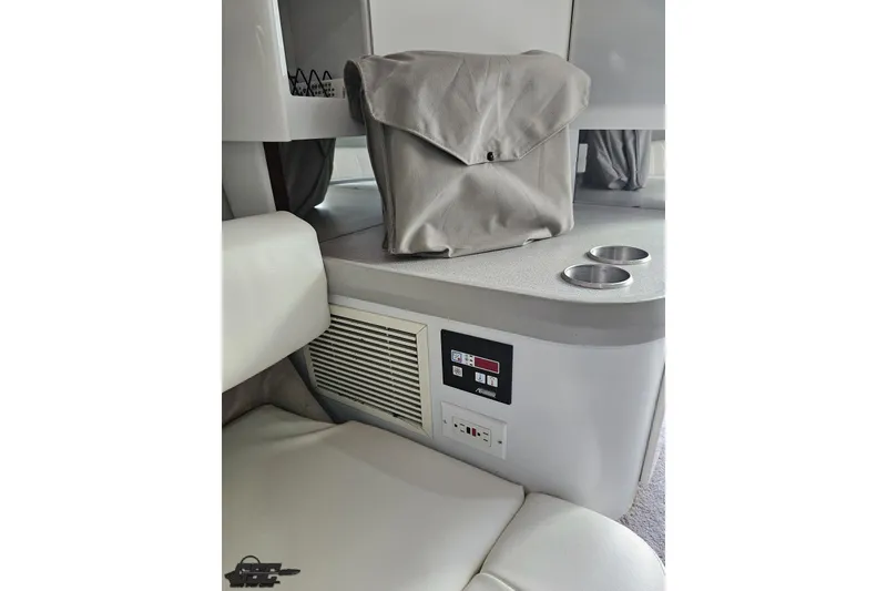 Slide: The Image of Interior of 1997 Formula 382 FASTech boat with seating, control panel, and storage bag. - 85