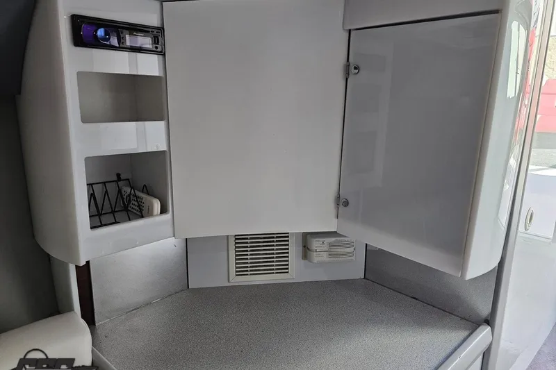 Slide: The Image of 1997 Formula 382 FASTech cabin interior with storage cabinets and stereo system. - 86