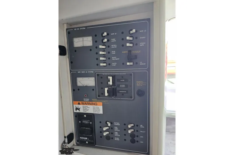 Slide: The Image of Electrical control panel of a 1997 Formula 382 FASTech boat, featuring switches and gauges. - 87