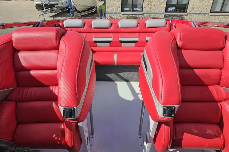 Slide: The Image of Red leather interior of a 1997 Formula 382 FASTech boat, featuring plush seating. - 94