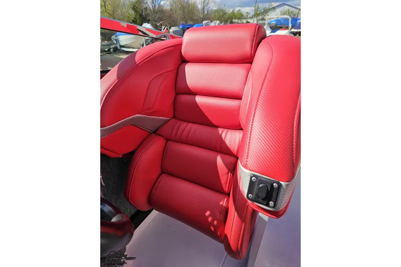 Slide: The Image of Red leather seat in a 1997 Formula 382 FASTech boat, showcasing luxury and comfort. - 95