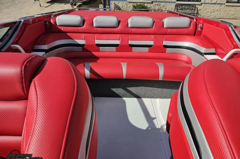 Slide: The Image of Red and silver interior of a 1997 Formula 382 FASTech boat, featuring plush seating. - 97