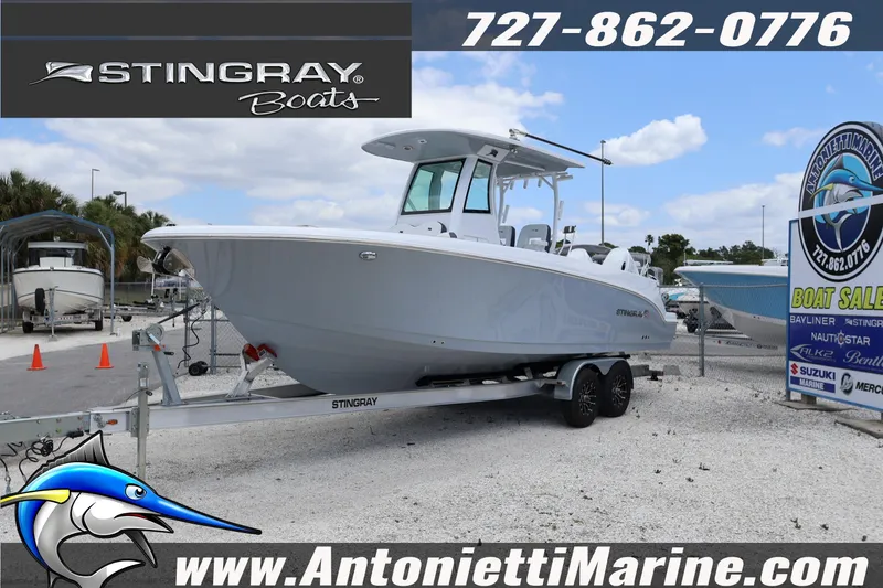 The Image of 2026 Stingray 253 CC boat on trailer at Antonietti Marine dealership. - 1