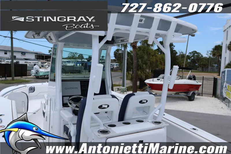 Slide: The Image of 2026 Stingray 253 CC boat with T-top and Garmin navigation, displayed at Antonietti Marine. - 10