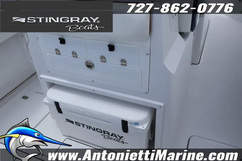 Slide: The Image of 2026 Stingray 253 CC boat interior with storage and Engel cooler. - 11