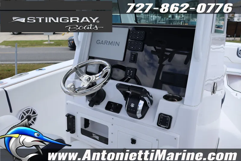 Slide: The Image of 2026 Stingray 253 CC boat dashboard with Garmin navigation and controls. - 14