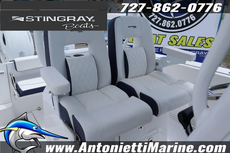 Slide: The Image of 2026 Stingray 253 CC boat seats, featuring luxurious white and navy design, showcased by Antonietti Marine. - 15
