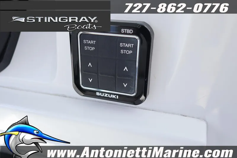 Slide: The Image of Control panel of 2026 Stingray 253 CC boat with Suzuki branding and contact details. - 20