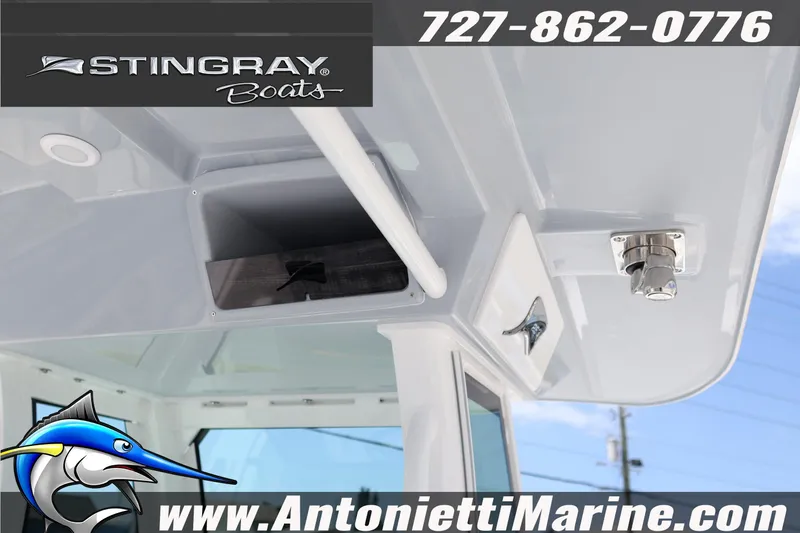 Slide: The Image of 2026 Stingray 253 CC boat interior with storage compartment and fixtures, Antonietti Marine branding. - 23