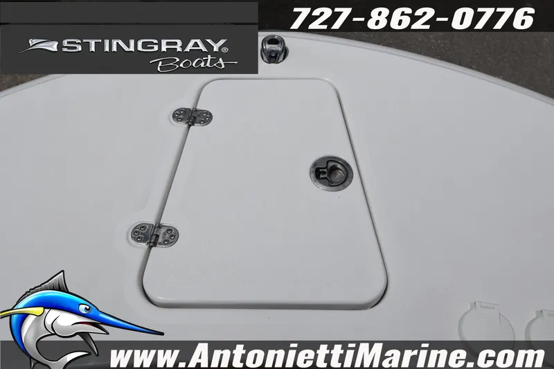 Slide: The Image of 2026 Stingray 253 CC boat deck with hatch, logo, and contact details. - 28