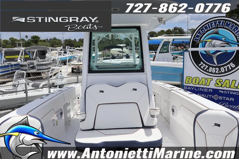 Slide: The Image of 2026 Stingray 253 CC boat at Antonietti Marine sales, featuring sleek interior design. - 30