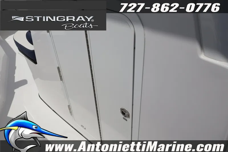 Slide: The Image of 2026 Stingray 253 CC boat detail with logo and contact information. - 31