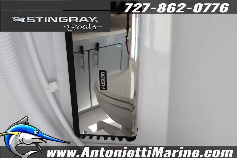 Slide: The Image of 2026 Stingray 253 CC boat interior with Fusion audio system, Antonietti Marine branding. - 35