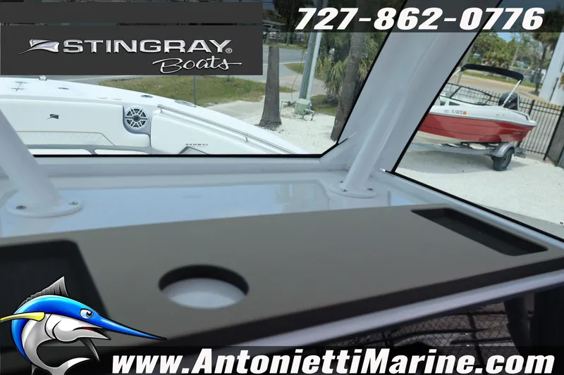 Slide: The Image of 2026 Stingray 253 CC boat interior with logo and contact details for Antonietti Marine. - 40