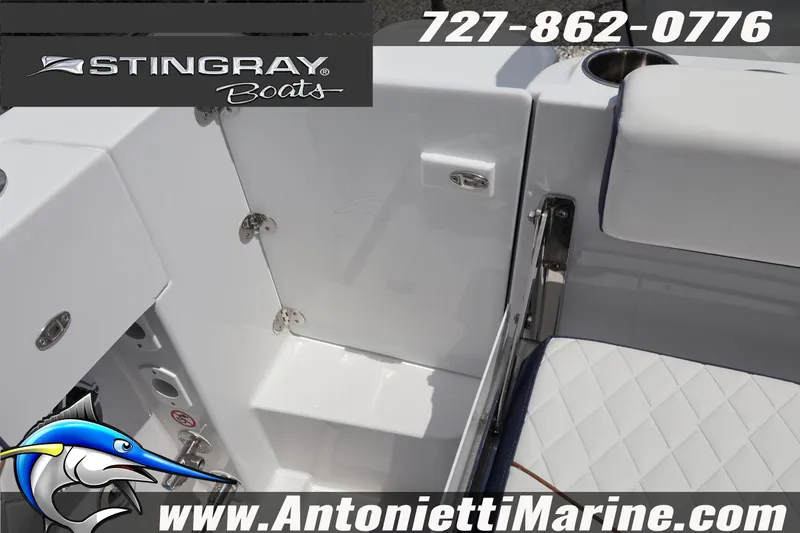 Slide: The Image of 2026 Stingray 253 CC boat interior with seating and cup holder, featuring Antonietti Marine branding. - 44