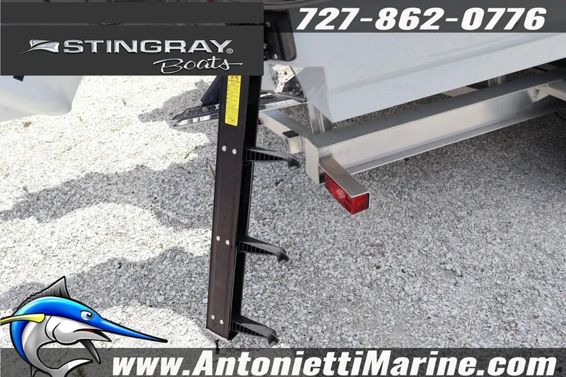 Slide: The Image of 2026 Stingray 253 CC boat trailer with ladder, featuring Antonietti Marine branding. - 47