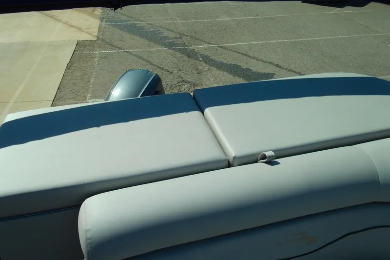 Slide: The Image of 2020 Bennington SV 188 SLV boat with cushioned seating, parked on pavement. - 15