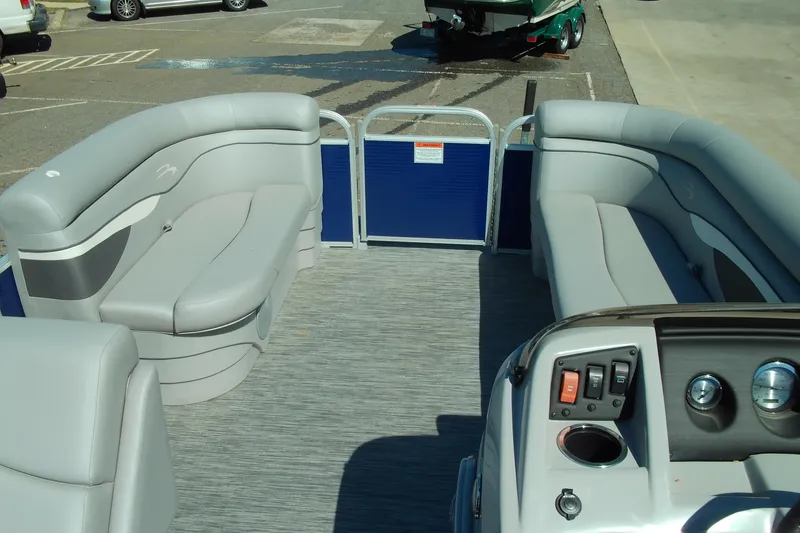 Slide: The Image of 2020 Bennington SV 188 SLV pontoon boat interior with gray seating and control panel. - 16