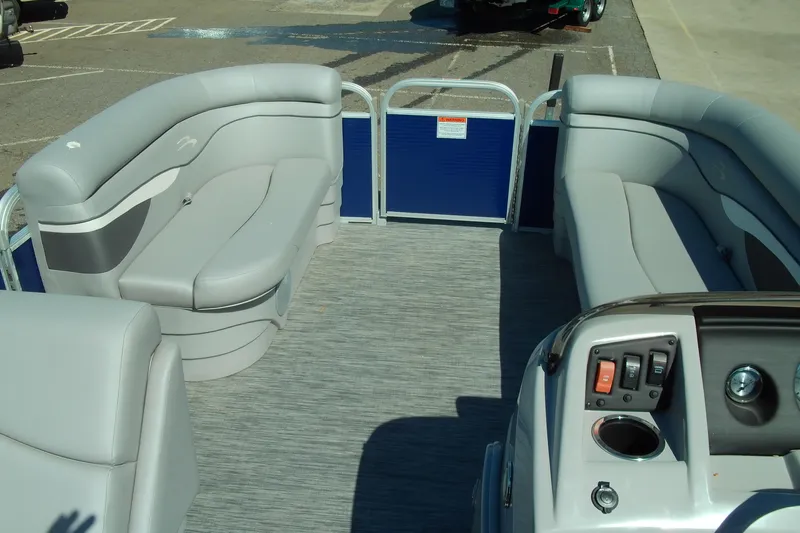 Slide: The Image of Interior of a 2020 Bennington SV 188 SLV pontoon boat with gray seating and control panel. - 17