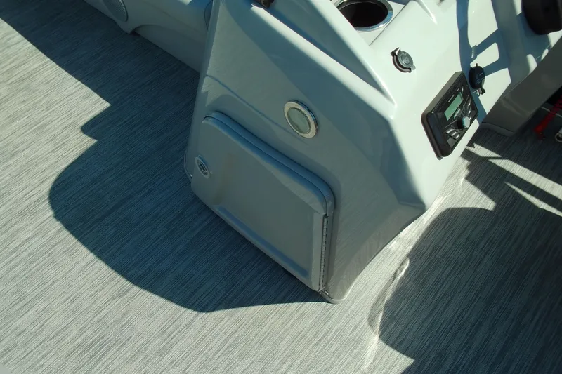 Slide: The Image of 2020 Bennington SV 188 SLV boat interior console with cup holder and controls. - 18