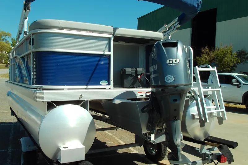Slide: The Image of 2020 Bennington SV 188 SLV pontoon boat with Yamaha 60 engine, parked outdoors. - 5