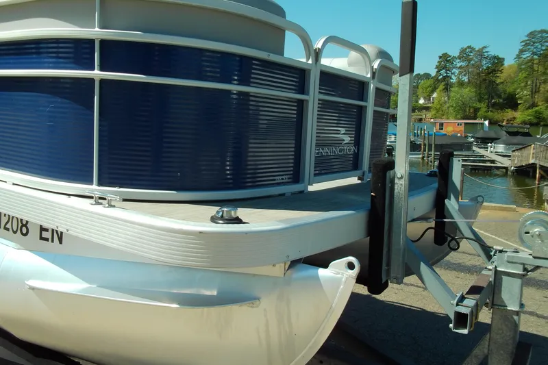 Slide: The Image of 2020 Bennington SV 188 SLV pontoon boat on trailer at marina. - 8