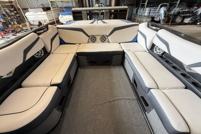 Slide: The Image of Interior of a 2015 Axis T23 boat with spacious seating and built-in speakers. - 19