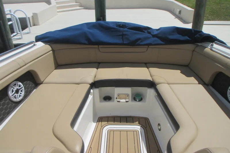 Slide: The Image of Luxurious seating area on a 2019 Sea Ray 290 SLX boat, featuring tan upholstery. - 15