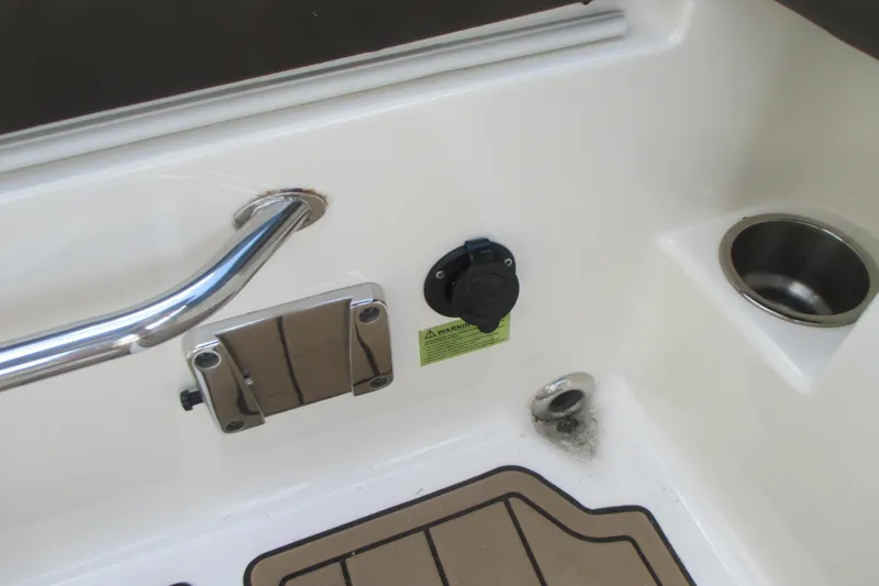 Slide: The Image of 2019 Sea Ray 290 SLX boat deck with cup holder and railing. - 16