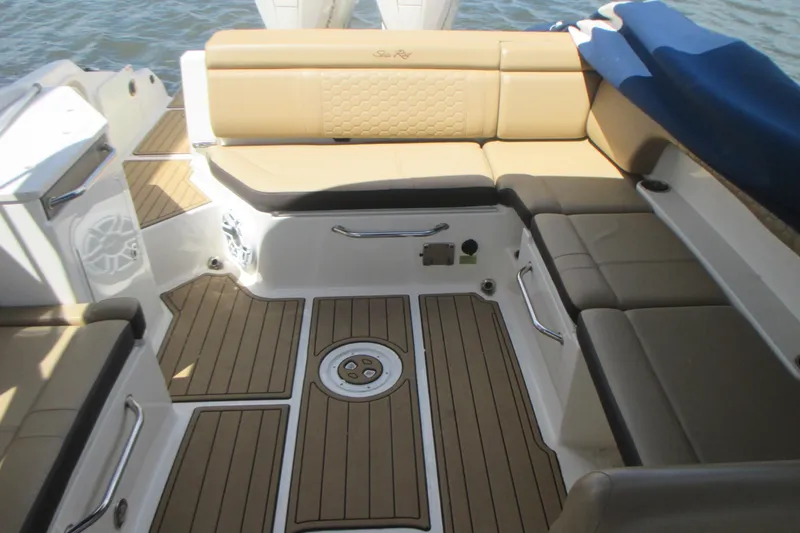 Slide: The Image of Luxurious interior of 2019 Sea Ray 290 SLX boat with tan seating and teak flooring. - 7