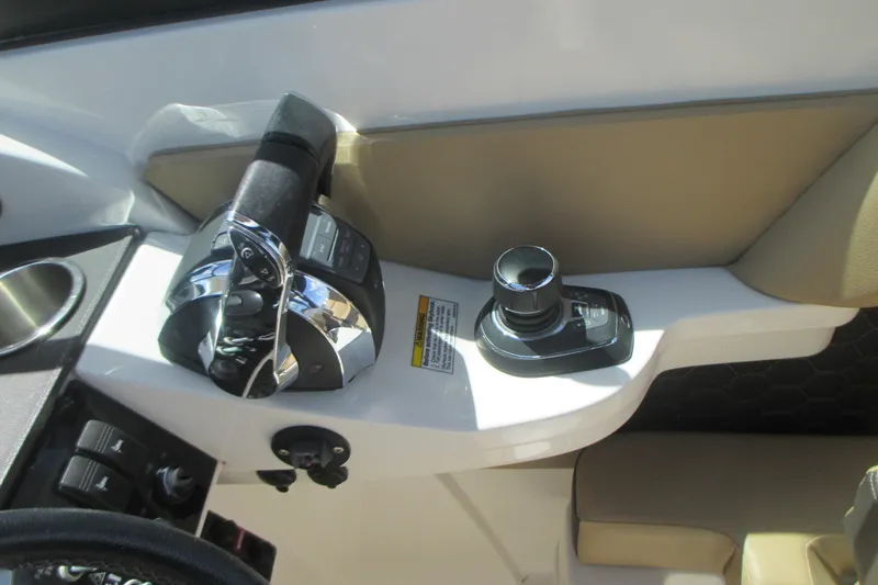 Slide: The Image of 2019 Sea Ray 290 SLX boat controls with joystick and throttle. - 9