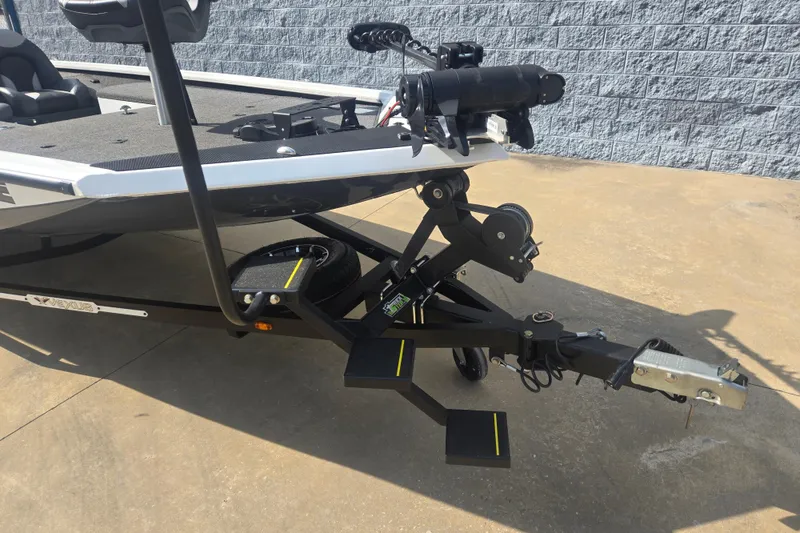 Slide: The Image of 2021 Vexus AVX181 boat trailer with steps and spare tire on concrete surface. - 11