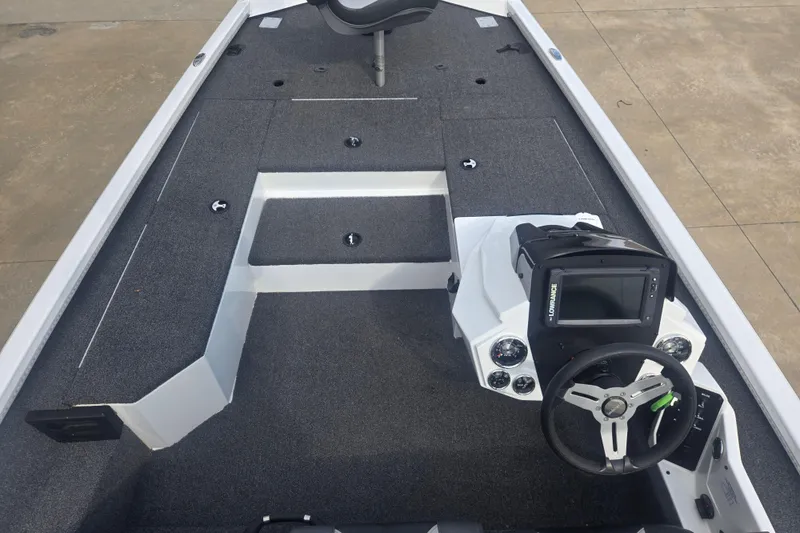 Slide: The Image of 2021 Vexus AVX181 boat interior with steering console and seating area. - 3