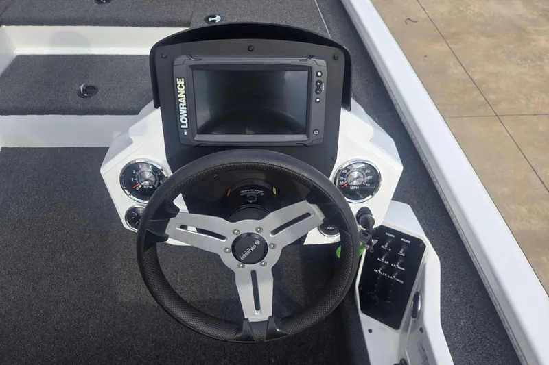 Slide: The Image of 2021 Vexus AVX181 boat dashboard with Lowrance display and steering wheel. - 6