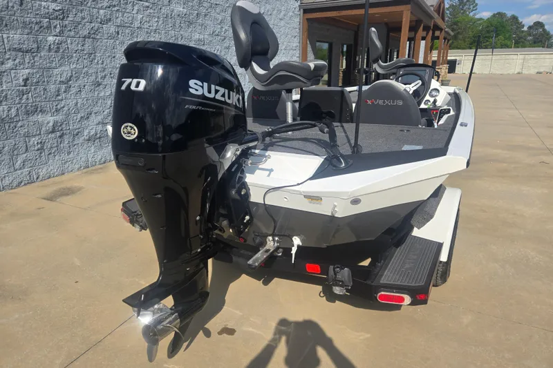 Slide: The Image of 2021 Vexus AVX181 boat with Suzuki 70 horsepower engine, parked outdoors. - 8