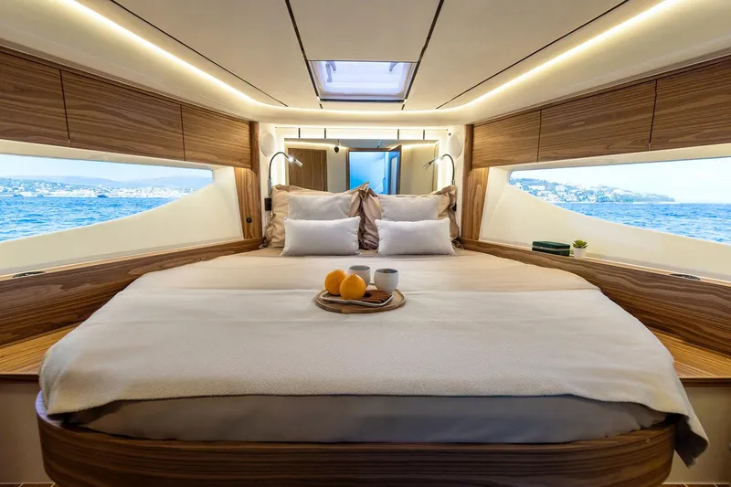 Slide: The Image of Manufacturer Provided Image: Luxurious Marex 390 yacht interior, 2025 model, featuring a cozy bedroom with ocean views. - 11