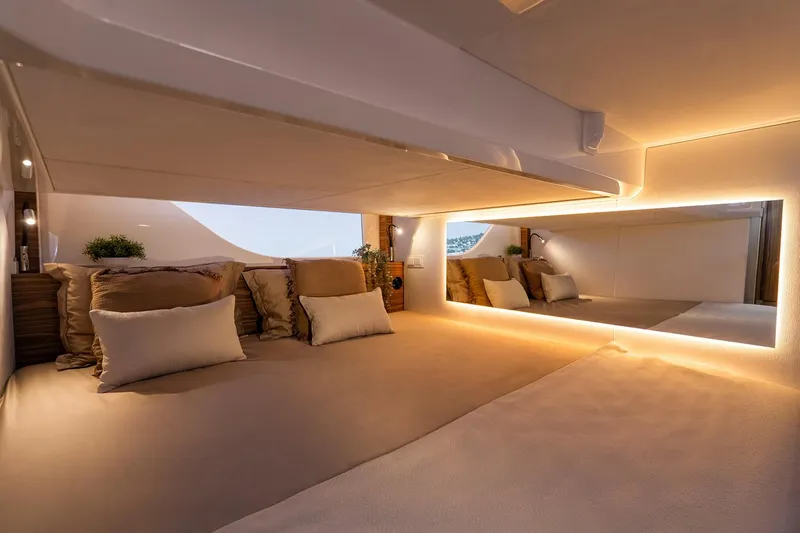 Slide: The Image of Manufacturer Provided Image: Luxurious interior cabin of 2025 Marex 390 yacht with elegant lighting and plush bedding. - 13