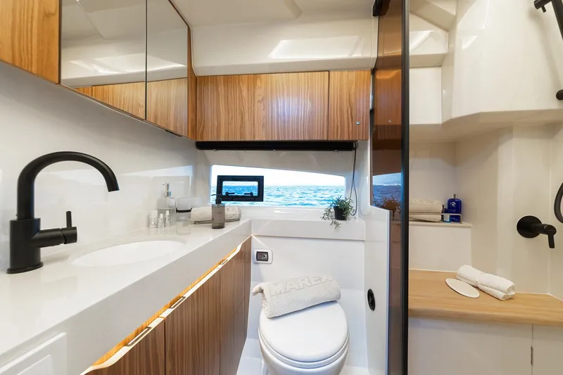 Slide: The Image of Manufacturer Provided Image: Luxurious bathroom interior of 2025 Marex 390 yacht with modern fixtures and sea view. - 14