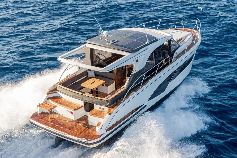 Slide: The Image of Manufacturer Provided Image: 2025 Marex 390 yacht cruising on open sea, showcasing sleek design and luxury features. - 4