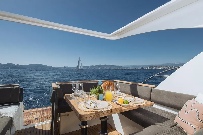 Slide: The Image of Manufacturer Provided Image: Luxurious Marex 390 yacht dining area with ocean view, 2025 model. - 5